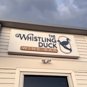 the whistling duck exterior signage